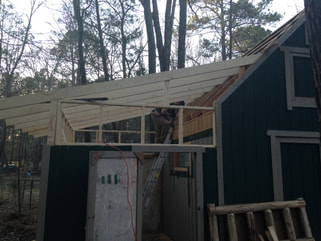 Handyman renovating shed